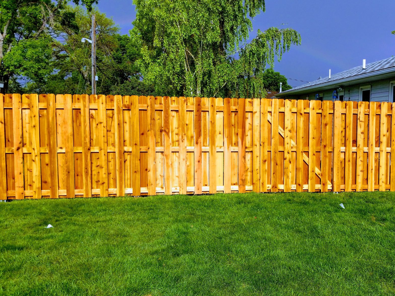 Photo of a tall, wood privacy fence