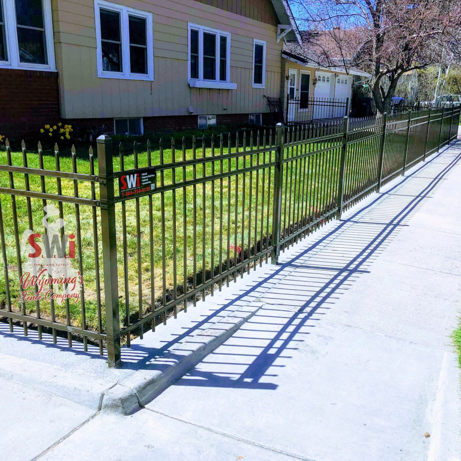 Photo of a decorative ornamental steel fence with finials