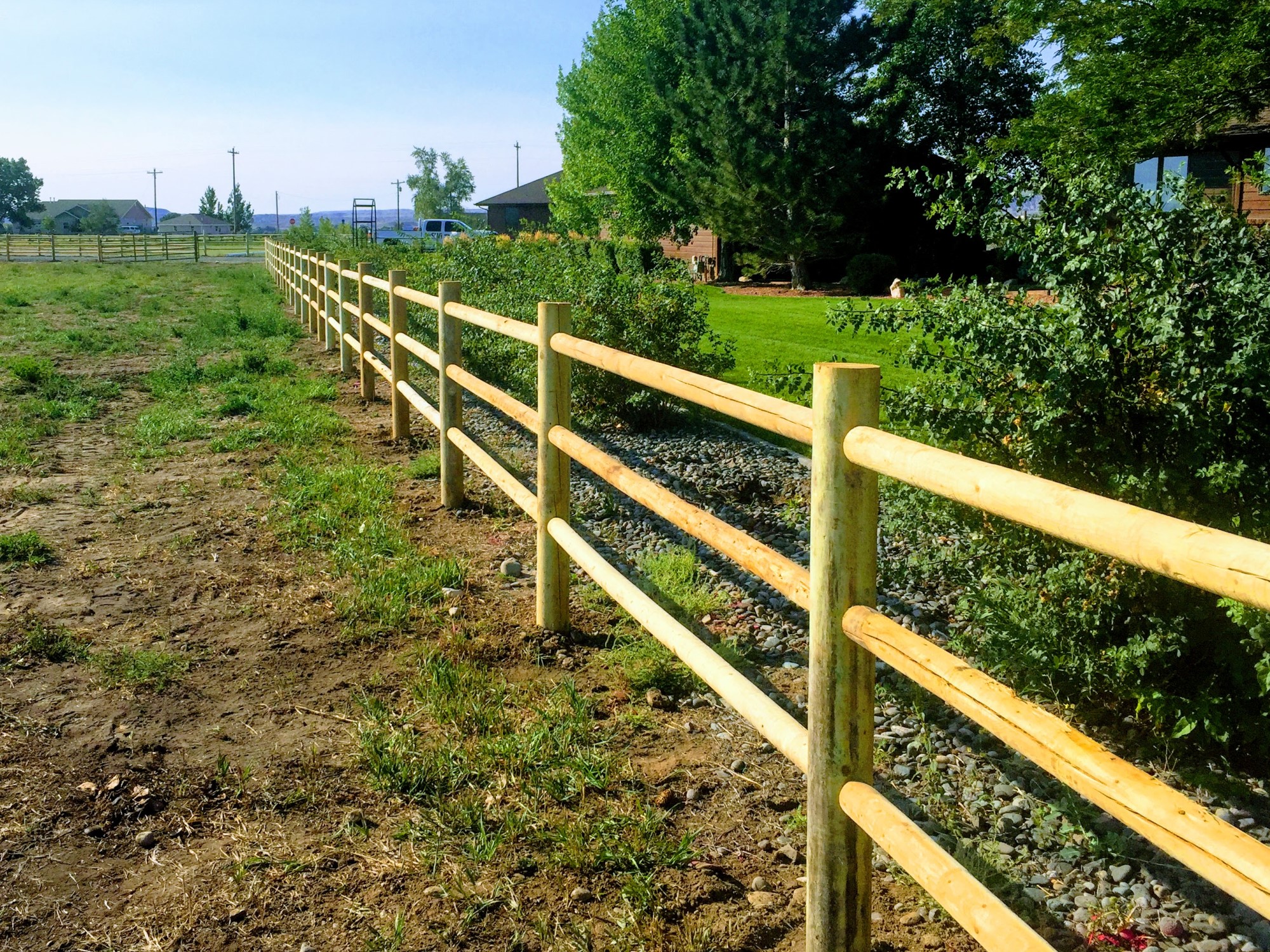 Photo of a 3 rail split rail wood fence