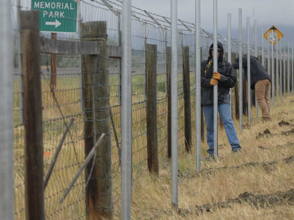 Photo of a fence line being placed by a Casper Wyoming fence company